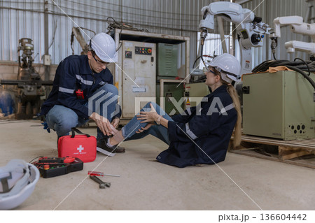First aid support accident at work of worker at factory.  136604442