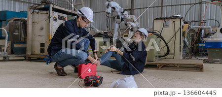 First aid support accident at work of worker at factory. First aid support accident at work of worker at factory. 136604445
