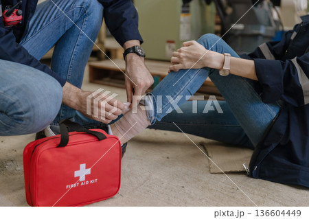 First aid support accident at work of worker at factory.  136604449