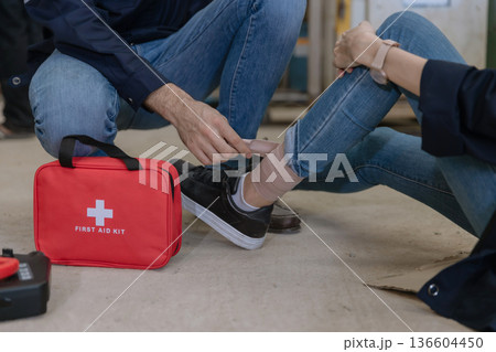 First aid support accident at work of worker at factory.  136604450