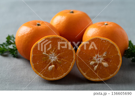 Mandarin tangerine orange fruit on fabric background Mandarin tangerine orange fruit on fabric background 136605690