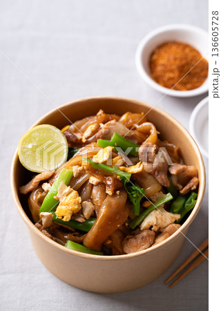 Thai food (Pad See Ew), Stir-fried rice noodles with soy sauce, pork, egg, and kale Thai food (Pad See Ew), Stir-fried rice noodles with soy sauce, pork, egg, and kale 136605728