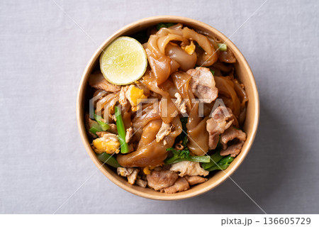 Thai food (Pad See Ew), Stir-fried rice noodles with soy sauce, pork, egg, and kale Thai food (Pad See Ew), Stir-fried rice noodles with soy sauce, pork, egg, and kale 136605729