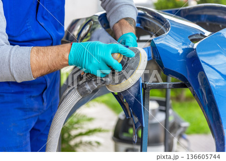 Bulgarian mechanic working in auto shop. Bulgarian mechanic working in auto shop. 136605744