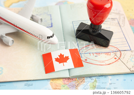 Approved Stamp visa and passport with Korea flag document to immigration at airport in country. Approved Stamp visa and passport with Korea flag document to immigration at airport in country. 136605792