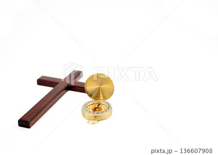 Golden Compass And Wooden Cross 136607908