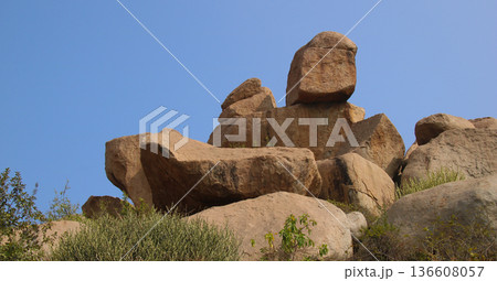 Unique shaped big granite boulders in Sanapur, village near Hampi, India. Unique shaped big granite boulders in Sanapur, village near Hampi, India. 136608057