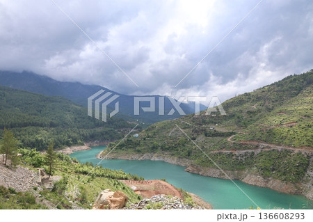 River winding valley. Reservoir in the mountains with turquoise water River winding valley. Reservoir in the mountains with turquoise water 136608293