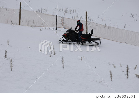 Snowy snowmobile solitude. High quality photo 136608371