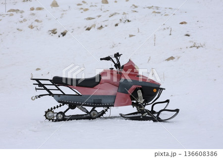 Snowy snowmobile solitude. High quality photo 136608386