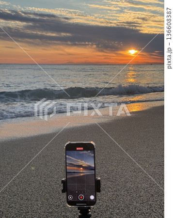 Shooting on the beach at sunset. High quality photo 136608387