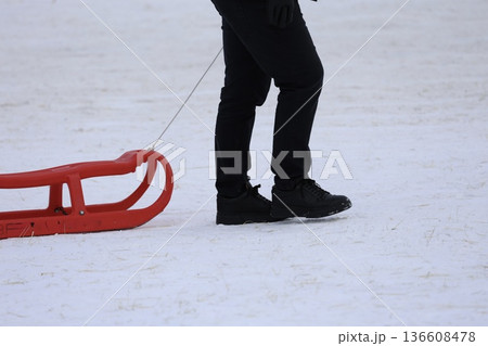 Person pulling sled. High quality photo 136608478