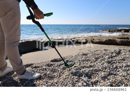 Beach metal detecting. High quality photo Beach metal detecting. High quality photo 136608961