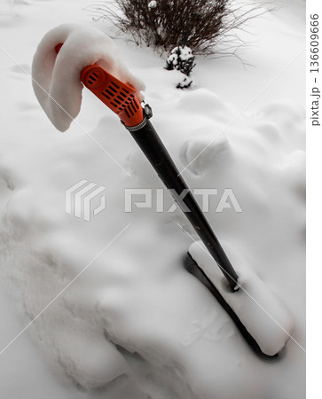 Snow on a shovel 136609666