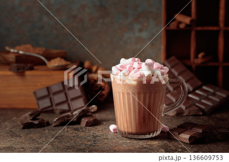 Hot chocolate drink with marshmallows on a brown background. 136609753