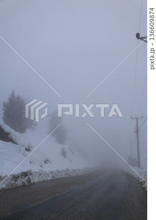 Foggy snowy road. High quality photo 136609874