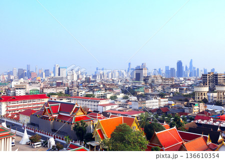 Aerial view cityscape of Bangkok with modern and old residential neighbourhood. Top view of Bangkok from Wat Saket Ratchawora, Thailand. Topic of summer vacation, relaxing, travel, trip, cruises, tour Aerial view cityscape of Bangkok with modern and old residential neighbourhood. Top view of Bangkok from Wat Saket Ratchawora, Thailand. Topic of summer vacation, relaxing, travel, trip, cruises, tour 136610354