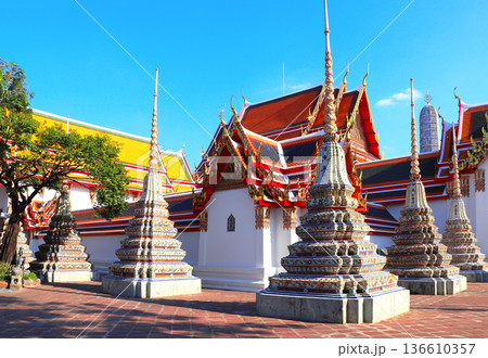 Stupas and ancient pavilion in Wat Pho (Temple of the Reclining Buddha, Wat Phra Chetuphon) complex, sightseeing landmark of Bangkok, Thailand. Topic of vacation, travel, trip, cruises, tour Stupas and ancient pavilion in Wat Pho (Temple of the Reclining Buddha, Wat Phra Chetuphon) complex, sightseeing landmark of Bangkok, Thailand. Topic of vacation, travel, trip, cruises, tour 136610357