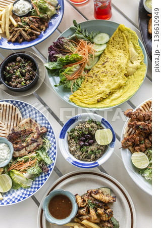 many different mediterranean food dishes on restaurant table in greece many different mediterranean food dishes on restaurant table in greece 136610949