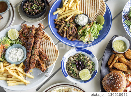 many different mediterranean food dishes on restaurant table in greece many different mediterranean food dishes on restaurant table in greece 136610951