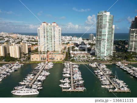 View of luxury Miami Florida. Summer vacation. Marina dock. Luxury South beach marina. Miami south beach view. Docked luxurious yacht boat. Luxurious lifestyle. Picturesque marina View of luxury Miami Florida. Summer vacation. Marina dock. Luxury South beach marina. Miami south beach view. Docked luxurious yacht boat. Luxurious lifestyle. Picturesque marina 136611115