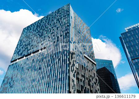 Skyscraper building architecture. Business skyscraper. Modern glass building. Skyscraper in city downtown. City downtown with skyscraper. Modern architecture. Office building in business area Skyscraper building architecture. Business skyscraper. Modern glass building. Skyscraper in city downtown. City downtown with skyscraper. Modern architecture. Office building in business area 136611179