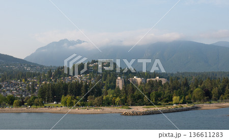 Stanley Park. Landscape view of Stanley Park in Vancouver. Landscape view of Stanley park and skyline of Vancouver, British Columbia. Coastal landscape and sea waterfront city Stanley Park. Landscape view of Stanley Park in Vancouver. Landscape view of Stanley park and skyline of Vancouver, British Columbia. Coastal landscape and sea waterfront city 136611283