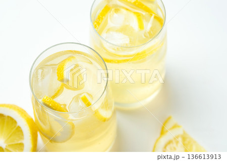 Homemade lemonade with lemon on a white background Homemade lemonade with lemon on a white background 136613913