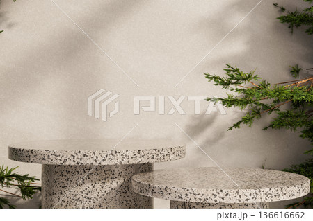Empty round stone table display platform and pine tree branch and sunlight on cement wall background 136616662