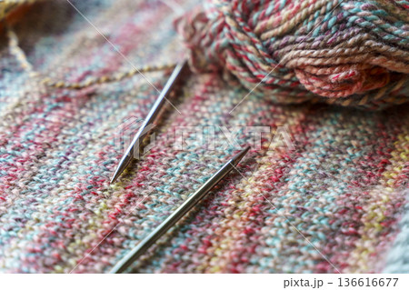 Cozy Handmade Knitting Scene with Colorful Wool Yarn Balls and Wooden Needles Cozy Handmade Knitting Scene with Colorful Wool Yarn Balls and Wooden Needles 136616677