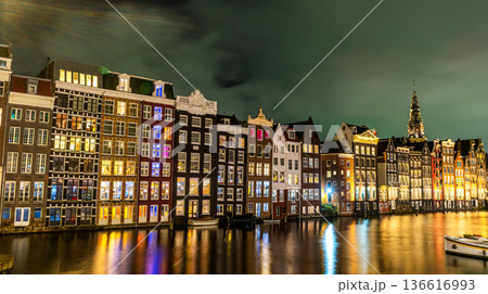 Amsterdam city at night. Old water canal houses in Netherlands Amsterdam city at night. Old water canal houses in Netherlands 136616993