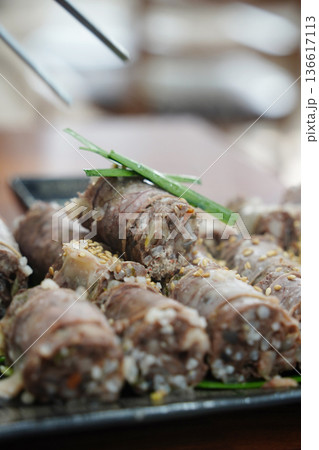 Close up of Sliced Korean Blood Sausage Sundae Garnished with Sesame Seeds and Green Onions Close up of Sliced Korean Blood Sausage Sundae Garnished with Sesame Seeds and Green Onions 136617113
