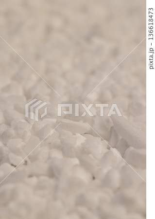 white coarse solid salt that is used in dishwashers to improve and soften water, coarse crystals of special salt for dishwashers for good and long-lasting dishwasher operation 136618473