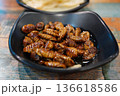 Traditional Korean Street Food Beondegi Boiled Silkworm Pupae in a Black Bowl 136618586
