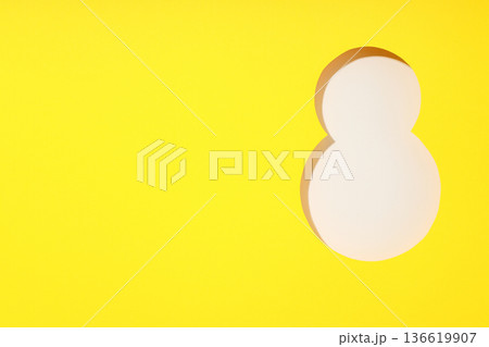 A vibrant yellow background featuring a large white number eight A vibrant yellow background featuring a large white number eight 136619907