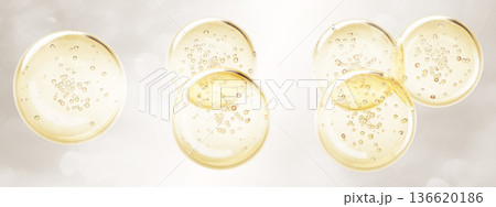 Golden oil drop texture with bubble 3d render icon set. Yellow liquid collagen gel sphere, gold serum circle stain top view. Keratin cosmetic fluid puddle on light beige background. 3D illustration 136620186