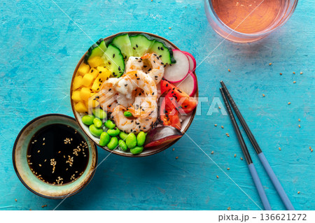 Poke bowl with shrimps, tomatoes, cucumber, mango, edamame, overhead shot Poke bowl with shrimps, tomatoes, cucumber, mango, edamame, overhead shot 136621272