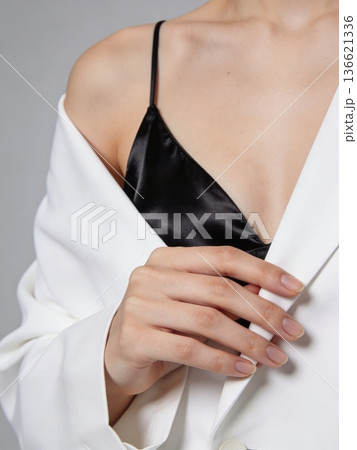 Chic portrait emphasizing fashion accessories. Refined image of female figure in modern attire 136621336