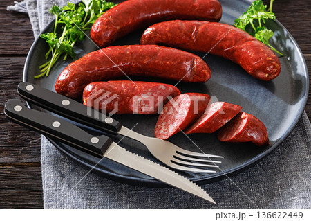 Smoked Swedish isterband sausages on a plate Smoked Swedish isterband sausages on a plate 136622449