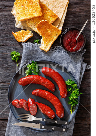 Smoked Swedish isterband sausages on a plate Smoked Swedish isterband sausages on a plate 136622458