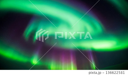 Beautiful green and purple northern lights aurora borealis shining in night sky with stars for nature background wallpaper design concept 136622581
