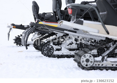 Snow-covered snowmobile tracks. High quality photo Snow-covered snowmobile tracks. High quality photo 136623152