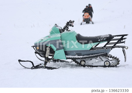 Snowy snowmobile solitude. High quality photo 136623330