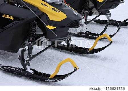 Snow-covered snowmobile tracks. High quality photo 136623336