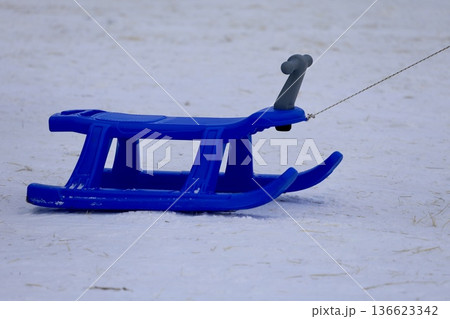 Blue plastic sled. High quality photo 136623342