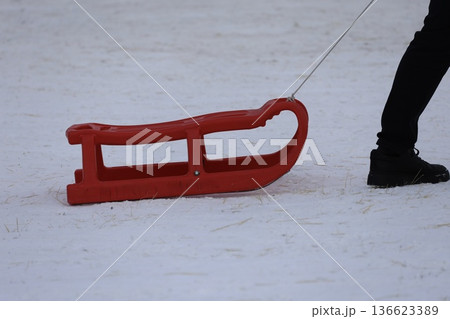 Person pulling sled. High quality photo 136623389