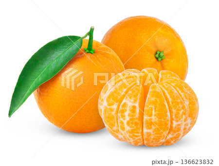 Tangerine or clementine with green leaf and peeled slice isolated. Fresh mandarines with leaves. Tangerine or clementine with green leaf and peeled slice isolated. Fresh mandarines with leaves. 136623832