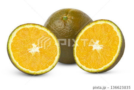 Chocolate navel orange and two slices isolated. Half of brown chocolate orange and whole chocolate navel orange isolated. Chocolate navel orange and two slices isolated. Half of brown chocolate orange and whole chocolate navel orange isolated. 136623835