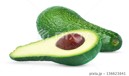 Whole fresh avocado and half of avocado with seed or pit isolated. Whole fresh avocado and half of avocado with seed or pit isolated. 136623841