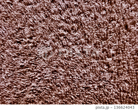 close up of brown shaggy carpet texture with soft fuzzy fibers in warm earth tones for cozy background or wallpaper design close up of brown shaggy carpet texture with soft fuzzy fibers in warm earth tones for cozy background or wallpaper design 136624043